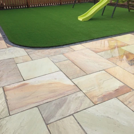 Golden Fossil patio paving pavers feature rich golden shades and fossil designs, transforming outdoor spaces with elegant natural stone beauty.