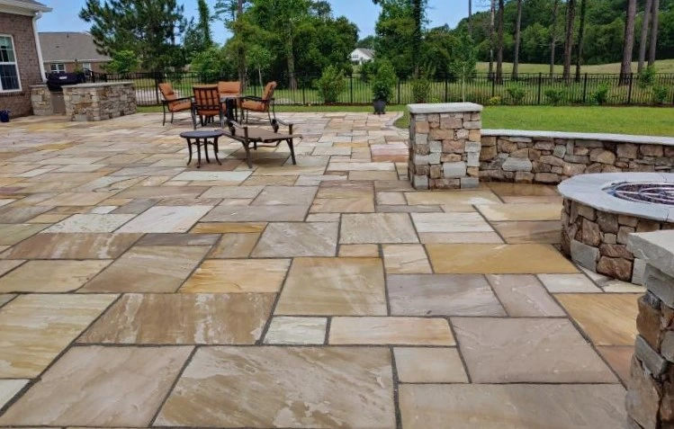 Elevate your outdoor retreat with Golden Fossil patio pavers, showcasing radiant golden tones and distinct fossil designs that reflect your style.