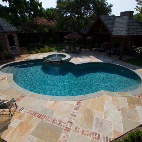 Transform your pool deck with Harvest Classicstone patio pavers, providing a stylish and durable surface for a perfect outdoor retreat.