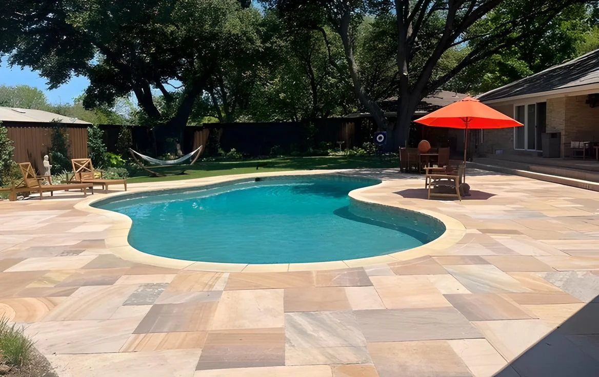 Beautify your pool deck with Harvest Classicstone patio pavers, combining durability and style for an inviting outdoor oasis.