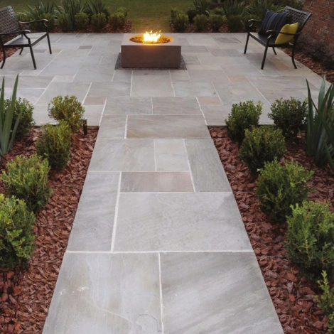 Promenade patio paving pavers offer sleek designs and a sophisticated color palette, enhancing outdoor spaces with timeless stone elegance and charm.