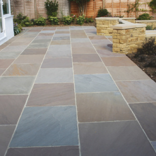 Transform your patio with beautiful stone and pavers, creating a welcoming space for family and friends to relax and enjoy special moments together.