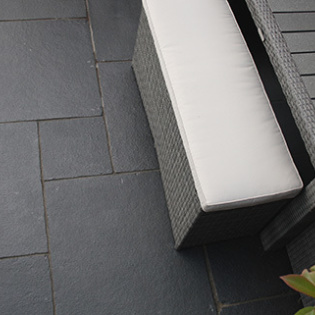 Stylish Charcoal Classicstone pavers elevate an outdoor environment with their deep hue and lasting strength.