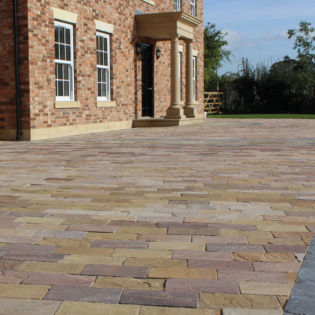 Transform your driveway with beautiful stone pavers, enhancing durability and style for a cohesive and inviting outdoor space.