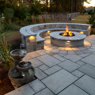 Promenade pavers create a charming outdoor space, blending classic design with lasting strength and elegance.