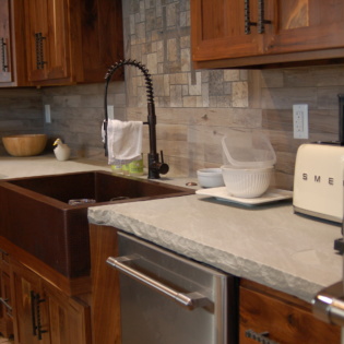 A luxurious countertop made from natural stone, featuring a timeless and elegant design that enhances any kitchen or bathroom space.